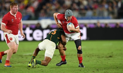 271019 - Wales v South Africa - Rugby World Cup Semi-Final - Jonathan Davies of Wales is tackled by Lukhanyo Am of South Africa