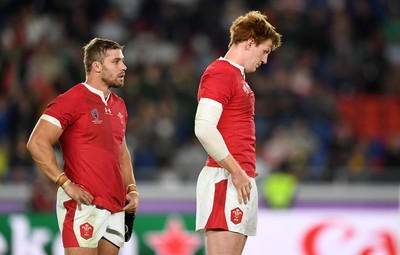 271019 - Wales v South Africa - Rugby World Cup Semi-Final - Dejected Leigh Halfpenny and Rhys Patchell of Wales