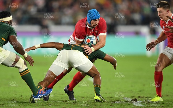 271019 - Wales v South Africa - Rugby World Cup Semi-Final - Justin Tipuric of Wales is tackled by Lukhanyo Am of South Africa