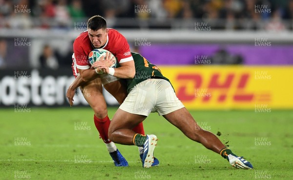 271019 - Wales v South Africa - Rugby World Cup Semi-Final - Owen Watkin of Wales is tackled by Damian de Allende of South Africa