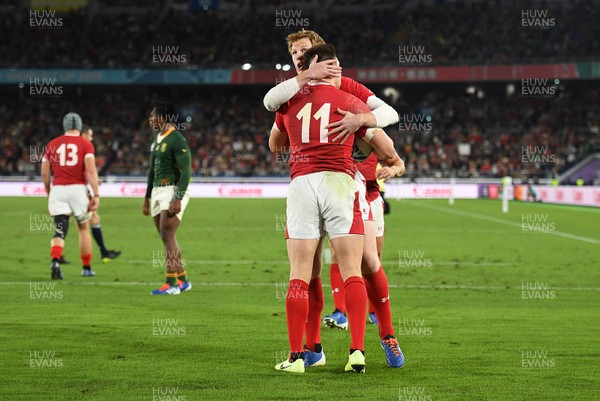 271019 - Wales v South Africa - Rugby World Cup Semi-Final - Josh Adams of Wales celebrates scoring a try with Rhys Patchell