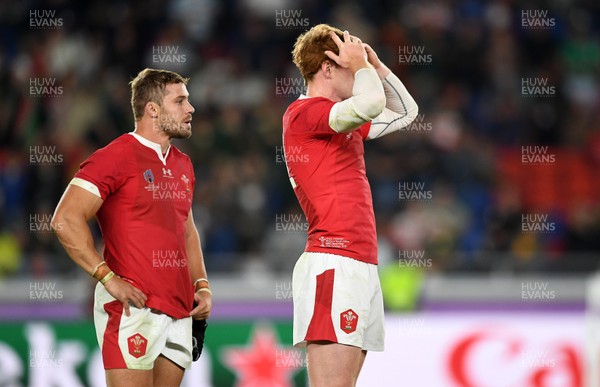 271019 - Wales v South Africa - Rugby World Cup Semi-Final - Dejected Leigh Halfpenny and Rhys Patchell of Wales