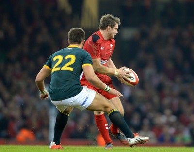 291114 - Wales v South Africa - Dove Men Series -Dan Biggar of Wales  is tackled by Handre Pollard of South Africa