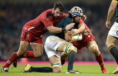 291114 - Wales v South Africa - Dove Men Series -Victor Matfield of South Africa is tackled by Scott Baldwin and Sam Warburton of Wales