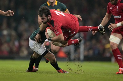 291114 - Wales v South Africa - Dove Men Series - Scott Baldwin of Wales is tackled by Cobus Oosthuizen of South Africa 