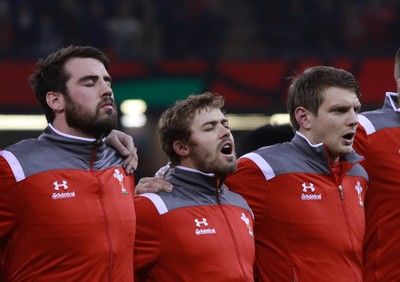 291114 - Wales v South Africa - Dove Men+Care Series -Scott Baldwin, Leigh Halfpenny and Dan Biggar of Wales line up for the national anthems