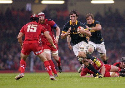 291114 - Wales v South Africa - Dove Men+Care Series -Eben Etzebeth of South Africa takes on Leigh Halfpenny of Wales