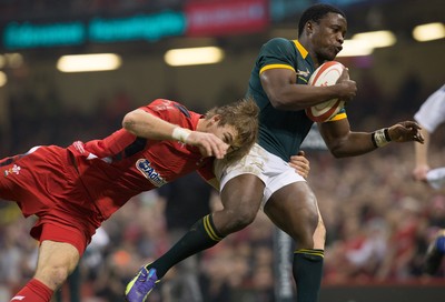 291114 - Wales v South Africa, Dove Men Series 2014, Cardiff - Lwazi Mvovo of South Africa is tackled by Liam Williams of Wales 