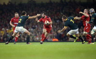 291114 - Wales v South Africa, Dove Men Series 2014, Cardiff - Scott Baldwin of Wales is tackled by Bismarck du Plessis of South Africa 