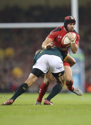 291114 - Wales v South Africa, Dove Men Series 2014, Cardiff - Leigh Halfpenny of Wales is tackled by Cornal Hendricks of South Africa 