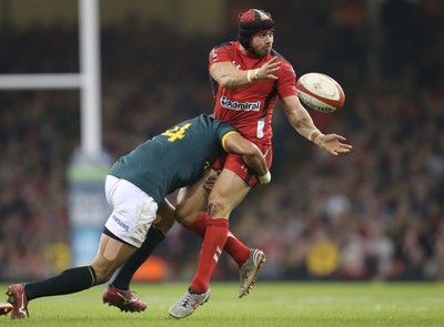 291114 - Wales v South Africa, Dove Men Series 2014, Cardiff - Leigh Halfpenny of Wales is tackled by Cornal Hendricks of South Africa 