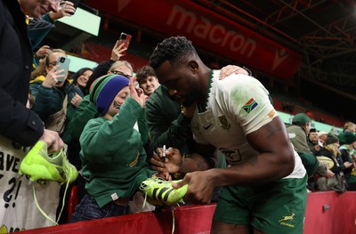291125 - Wales v South Africa Springboks - Quilter Nations Series - Taine Plumtree of Wales gives his boots to a young fan