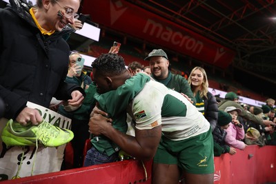 291125 - Wales v South Africa Springboks - Quilter Nations Series - Taine Plumtree of Wales gives his boots to a young fan