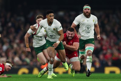 291125 - Wales v South Africa Springboks, Quilter Nations Series - Sacha Feinberg-Mngomezulu of South Africa is tackled by Gareth Thomas of Wales