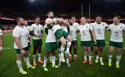 291125 - Wales v South Africa Springboks, Quilter Nations Series - Cobus Reinach of South Africa is lifted by Bongi Mbonambi of South Africa at the end of the match