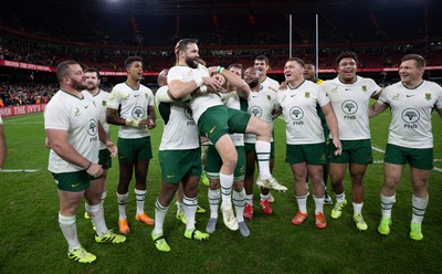 291125 - Wales v South Africa Springboks, Quilter Nations Series - Cobus Reinach of South Africa is lifted by Bongi Mbonambi of South Africa at the end of the match
