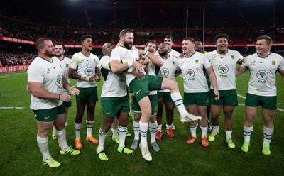 291125 - Wales v South Africa Springboks, Quilter Nations Series - Cobus Reinach of South Africa is lifted by Bongi Mbonambi of South Africa at the end of the match