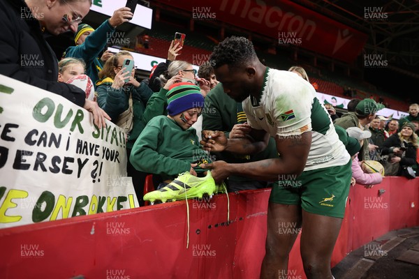 291125 - Wales v South Africa Springboks - Quilter Nations Series - Taine Plumtree of Wales gives his boots to a young fan