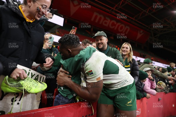 291125 - Wales v South Africa Springboks - Quilter Nations Series - Taine Plumtree of Wales gives his boots to a young fan