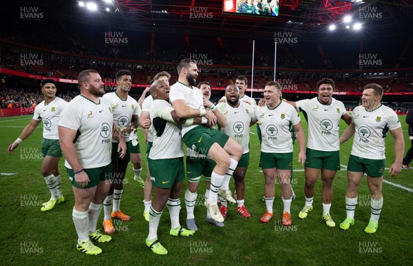 291125 - Wales v South Africa Springboks, Quilter Nations Series - Cobus Reinach of South Africa is lifted by Bongi Mbonambi of South Africa at the end of the match