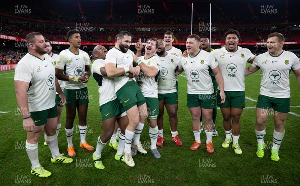 291125 - Wales v South Africa Springboks, Quilter Nations Series - Cobus Reinach of South Africa is lifted by Bongi Mbonambi of South Africa at the end of the match