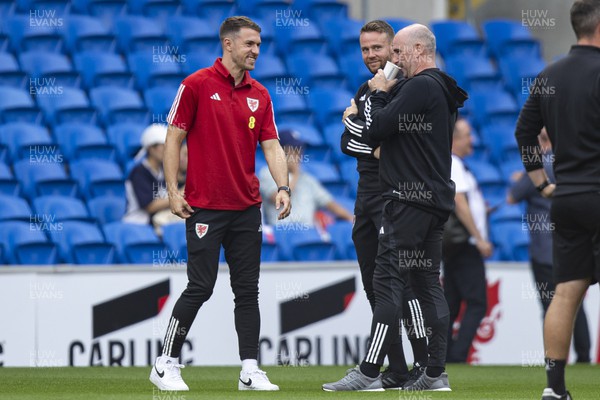 070923 - Wales v South Korea - International Friendly - Aaron Ramsey of Wales & Wales coach Chris Gunter inspect the pitch ahead of the match