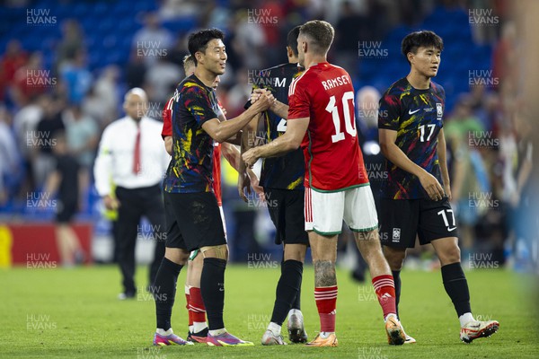 070923 - Wales v South Korea - International Friendly - Heung-Min Son of South Korea with Aaron Ramsey of Wales at full time