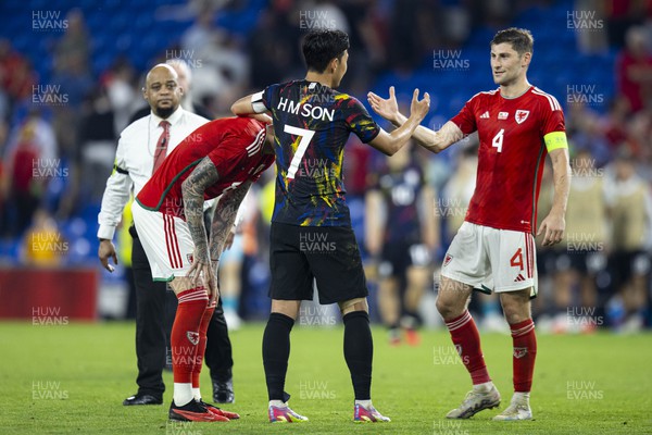 070923 - Wales v South Korea - International Friendly - Heung-Min Son of South Korea with Joe Rodon & Ben Davies of Wales at full time