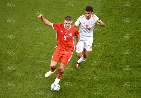 111018 - Wales v Spain - International Friendly Football - Sam Vokes of Wales is tackled by Rodri of Spain