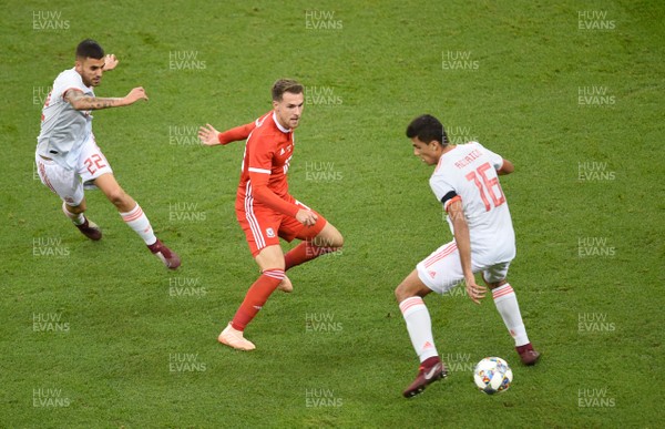111018 - Wales v Spain - International Friendly Football - Aaron Ramsey of Wales is tackled by Dani Ceballos and Rodri of Spain