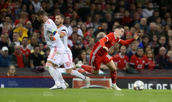 111018 - Wales v Spain - International Friendly - Harry Wilson of Wales is tackled by Sergio Ramos of Spain