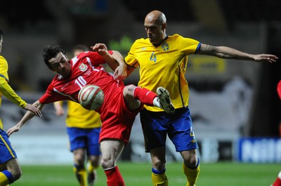 03.03.10 - International Football Friendly, Wales v Sweden Wales' Simon Davies is challenged by Sweden's Daniel Majstorovic 