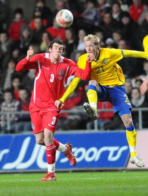 03.03.10 - International Football Friendly, Wales v Sweden Wales' Gareth Bale and Sweden's Christian Wilhelm compete 