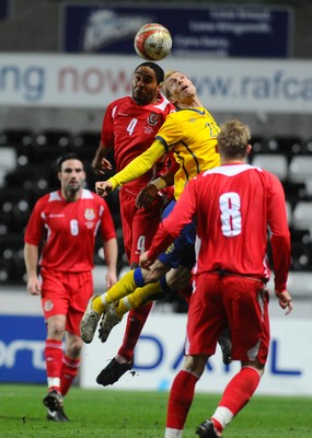 03.03.10 - International Football Friendly, Wales v Sweden Wales' Ashley Williams and Sweden's Christian Wilhelm go for a high ball 