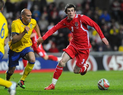 03.03.10 - International Football Friendly, Wales v Sweden Wales' Gareth Bale is challenged by Sweden's Daniel Majstorovic 