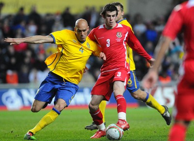 03.03.10 - International Football Friendly, Wales v Sweden Wales' Gareth Bale is challenged by Sweden's Daniel Majstorovic 