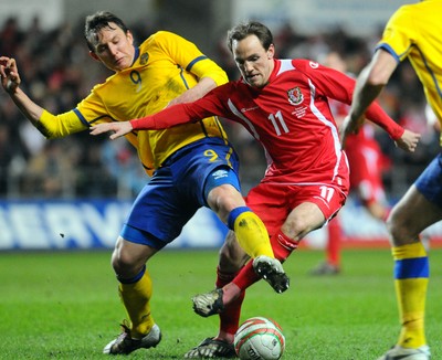 03.03.10 - International Football Friendly, Wales v Sweden Wales' David Vaughan and Sweden's Kim Kallstrom compete 