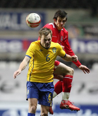 03.03.10 ... Wales v Sweden, Friendly International, Swansea -  Wales' Gareth Bale and Sweden's Sebastian Larsson compete for the ball 
