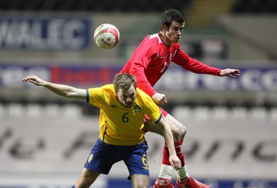03.03.10 ... Wales v Sweden, Friendly International, Swansea -  Wales' Gareth Bale and Sweden's Sebastian Larsson compete for the ball 
