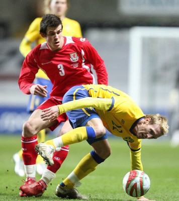 03.03.10 ... Wales v Sweden, Friendly International, Swansea -  Wales' Gareth Bale tangles with Sweden's Christian Wilhelmsson  