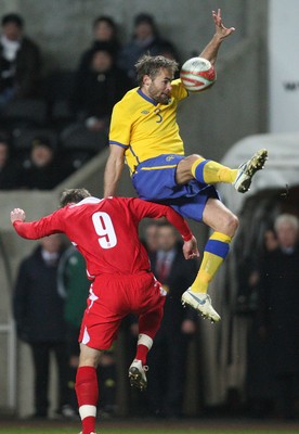 03.03.10 ... Wales v Sweden, Friendly International, Swansea -  Sweden's Olof Mellberg is challenged by Wales' Simon Church   