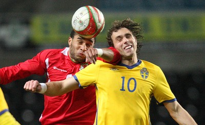 03.03.10 ... Wales v Sweden, Friendly International, Swansea -  Wales' Ashley Williams and Sweden's Johan Elmander compete for the ball 