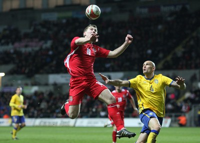 03.03.10 ... Wales v Sweden, Friendly International, Swansea -  Wales' Sam Vokes beats Sweden's Daniel Majstorovic to the ball 