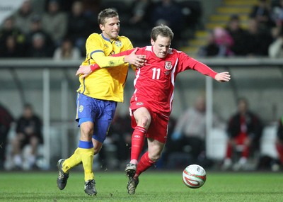 03.03.10 ... Wales v Sweden, Friendly International, Swansea -  Wales' David Vaughan holds off Sweden's Anders Svensson  