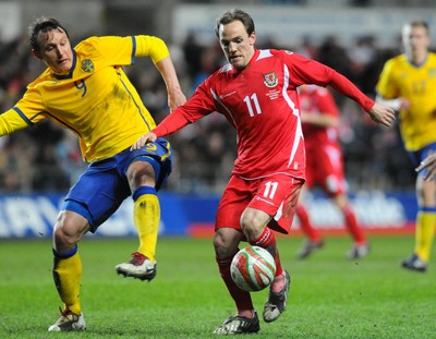 03.03.10 - International Football Friendly, Wales v Sweden Wales' David Vaughan and Sweden's Kim Kallstrom compete 