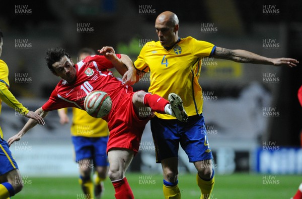 03.03.10 - International Football Friendly, Wales v Sweden Wales' Simon Davies is challenged by Sweden's Daniel Majstorovic 