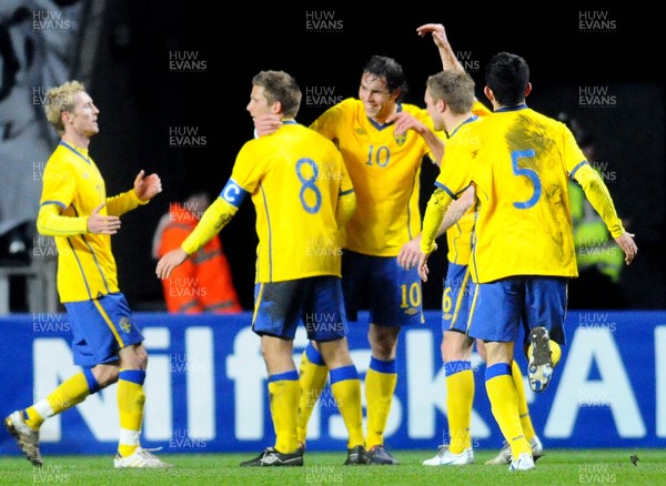 03.03.10 - International Football Friendly, Wales v Sweden Sweden's Johan Elmander is congratulated after scoring goal 