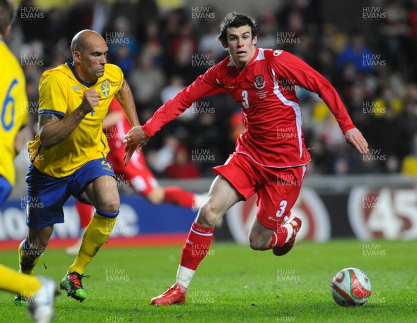 03.03.10 - International Football Friendly, Wales v Sweden Wales' Gareth Bale is challenged by Sweden's Daniel Majstorovic 