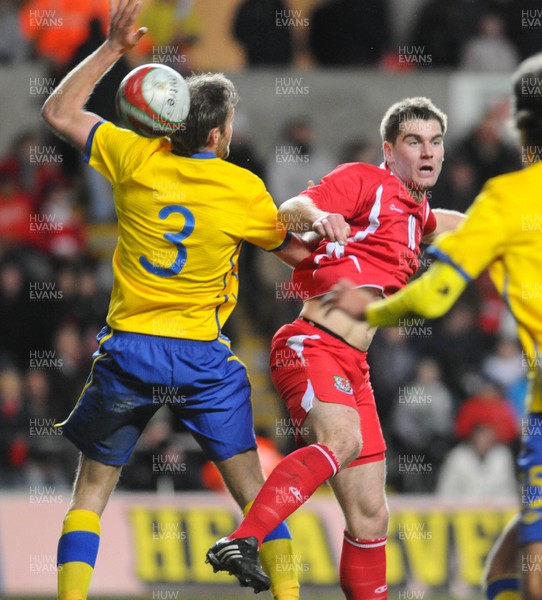 03.03.10 - International Football Friendly, Wales v Sweden Wales' Sam Vokes is challenged by Sweden's Olaf Mellberg 