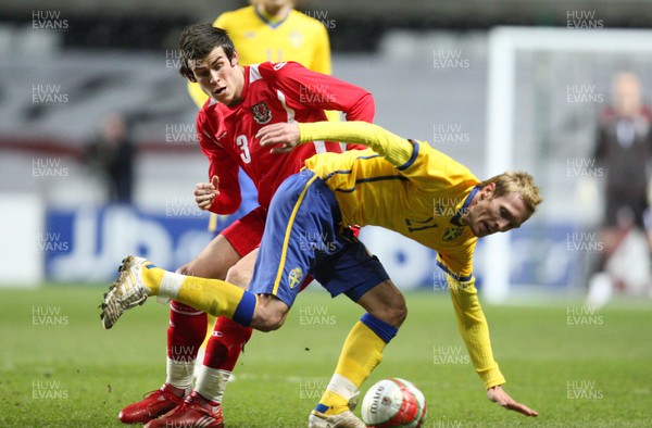 03.03.10 ... Wales v Sweden, Friendly International, Swansea -  Wales' Gareth Bale tangles with Sweden's Christian Wilhelmsson  